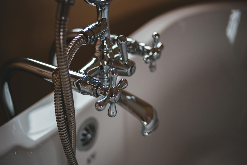 signs replace plumbing fixtures Gold Coast - chrome bathroom faucet showing age