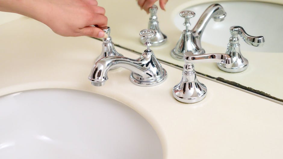 fixture installation mistakes Gold Coast plumber - hand adjusting chrome faucet valve in bathroom