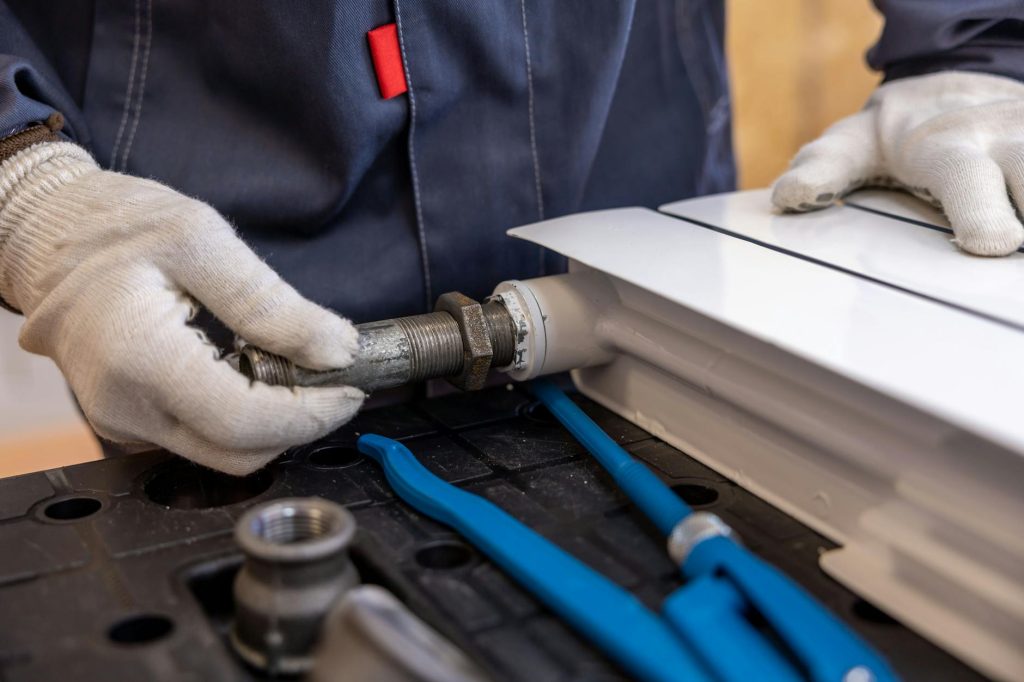 how much does a plumber cost Gold Coast - plumber at work