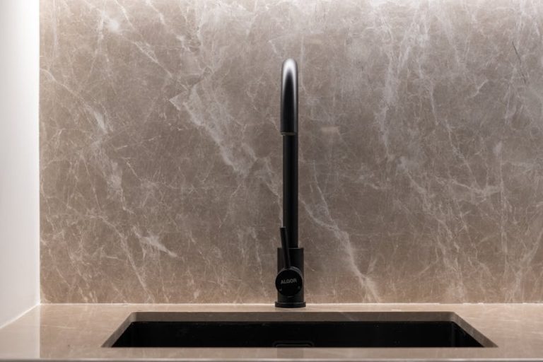 smart taps Gold Coast - stylish modern black kitchen faucet with marble backsplash